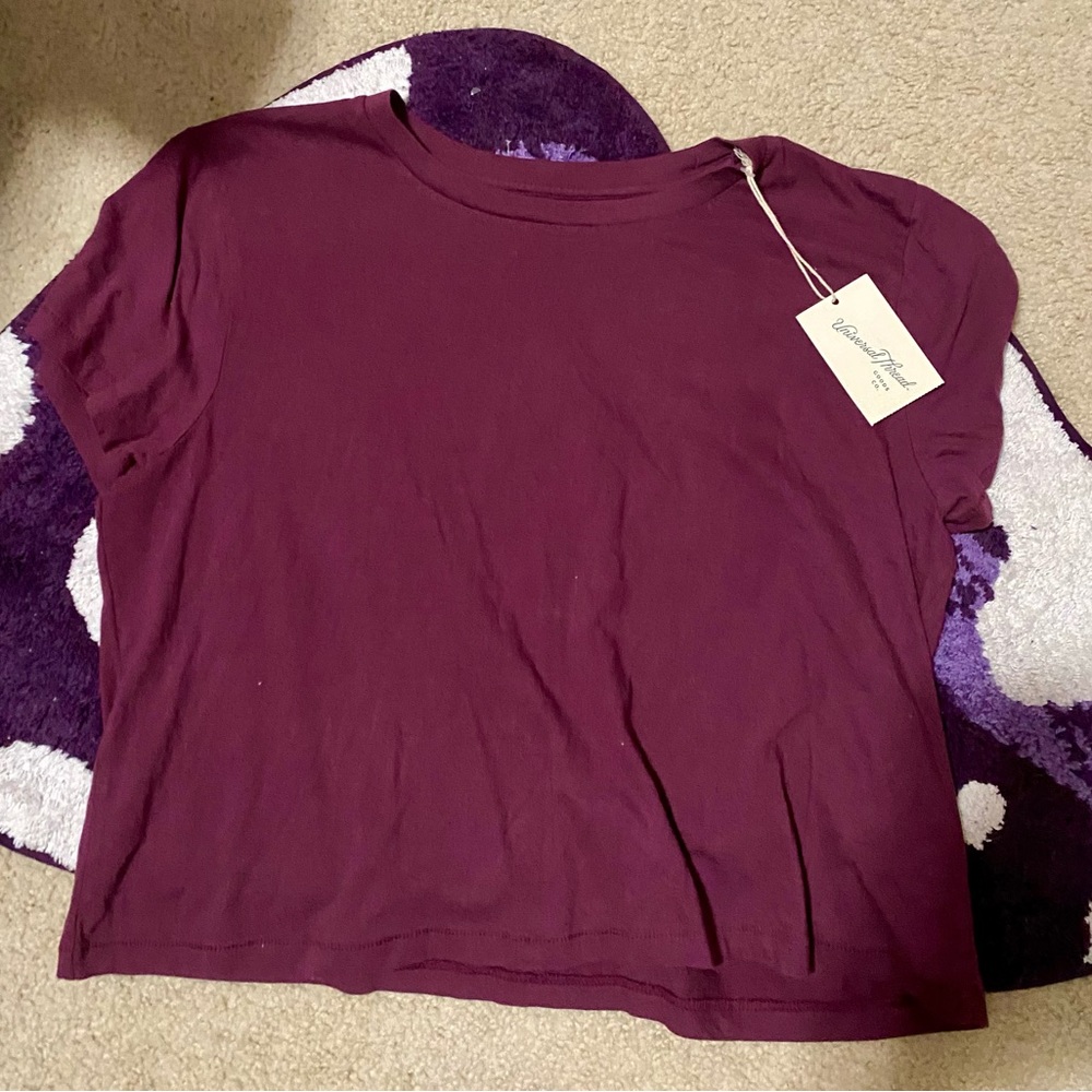 New w/tags never worn.Crop top type.  go super cute with high waisted leggings